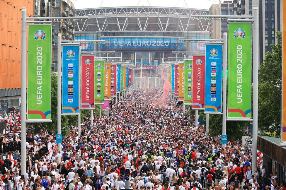 Fans gather ahead of the Euro 2020 final against Italy at Wembley