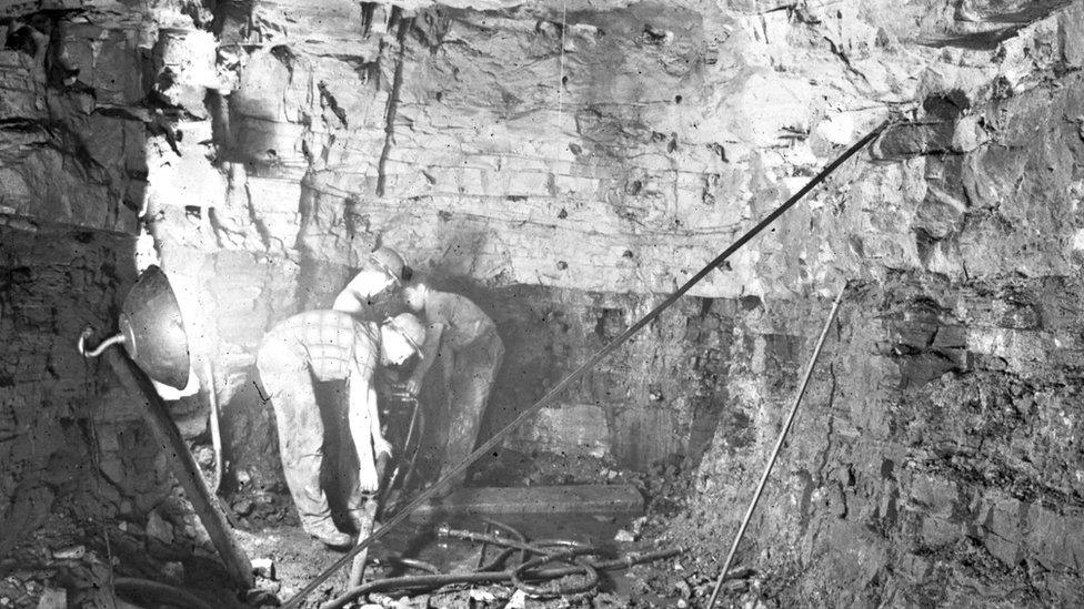 Workers during the pilot tunnel excavations