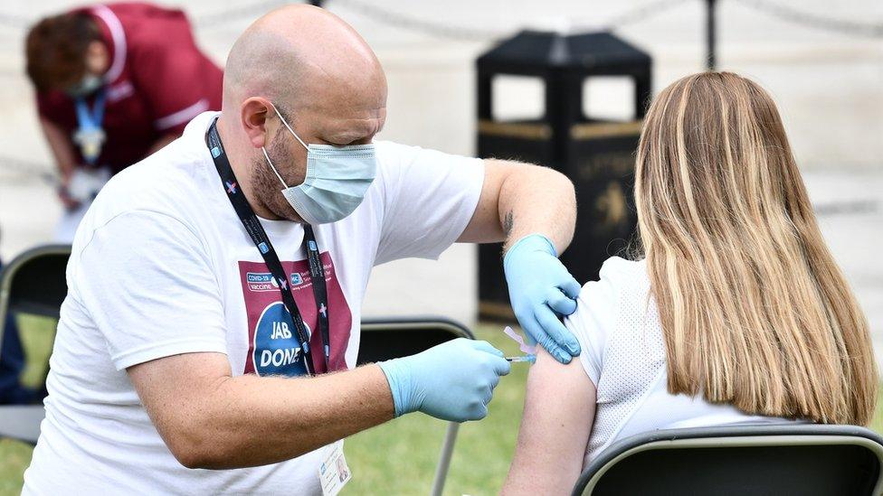 Young woman getting Covid jab on 4th July