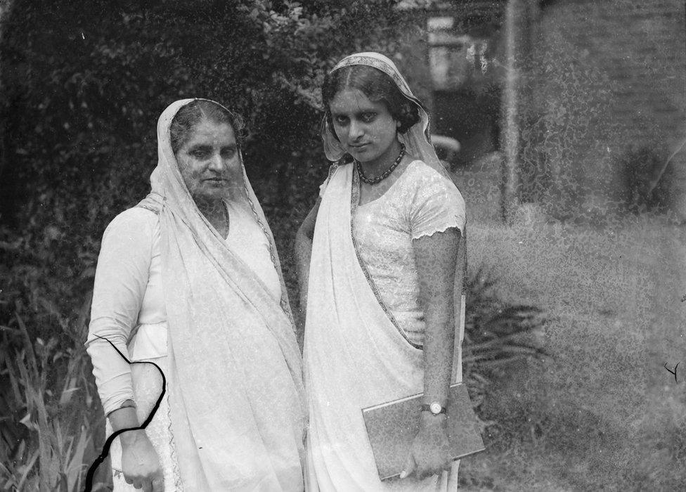 Nineteen year old girl from Ceylon passes bar examination . Not to be called till she is 21 . Miss Avabai Menta , a nineteen year old girl from Colombo , Ceylon has passed the examination for a call to the English Bar . She cannot be called until she is 21 . Miss Mehta was a brilliant scholar at the Maria Grey Training College , London and after she matriculated she read for the Bar in Lincoln ' s Inn . She will be the first woman barrister in Ceylon , although there are several in India . Photo shows , Miss Avabai Mehta , holding book , and another woman photographed at her London home after her success had been announced . 16 June 1933