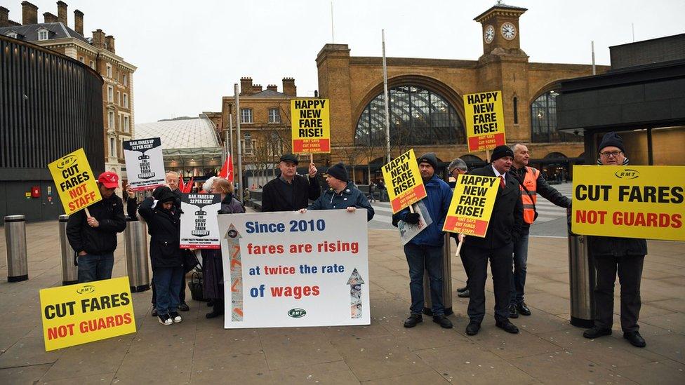 Campaigners protest against rail fare increases outside Kings Cross station in London