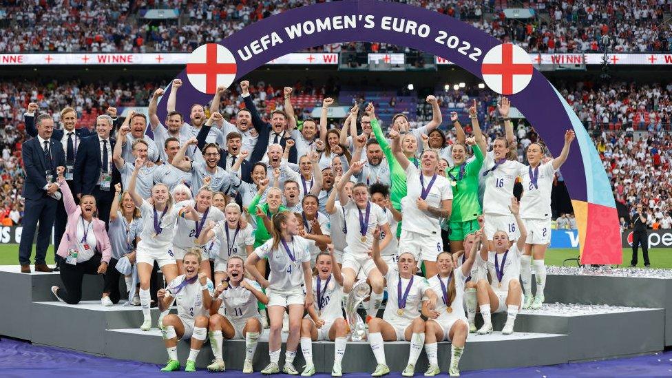 The England Team celebrate on the podium following victory in the UEFA Women's Euro 2022 final match between England and Germany at Wembley Stadium on July 31, 2022 in London, England.