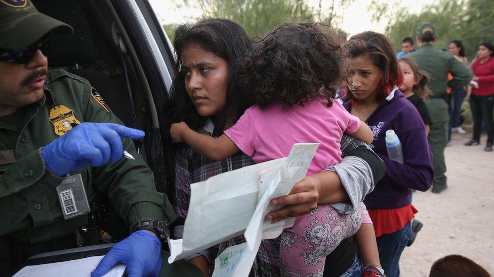 A undocumented Mexican family is taken into custody by US immigration officials.