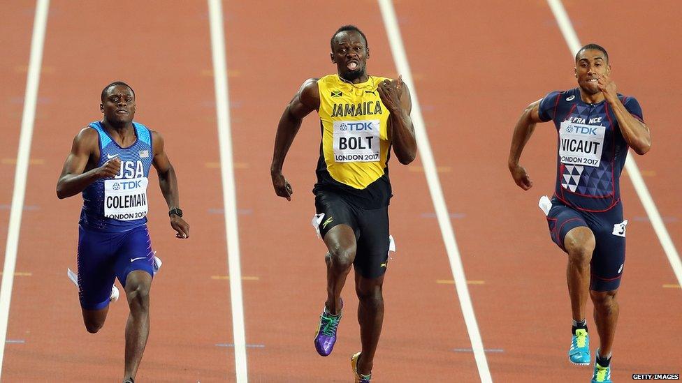 This is a photo of Christian Coleman and Usain Bolt racing side by side in the 100m finals.