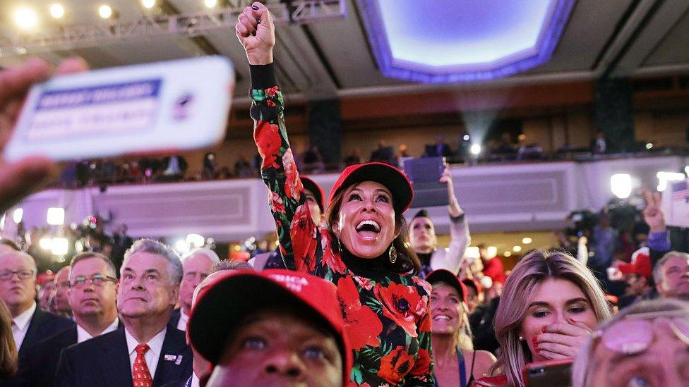 upporters of Republican presidential nominee Donald Trump cheer during the election night event at the New York Hilton Midtown on November 8, 2016 in New York City.