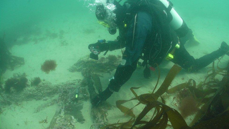 A diver next to the wreck