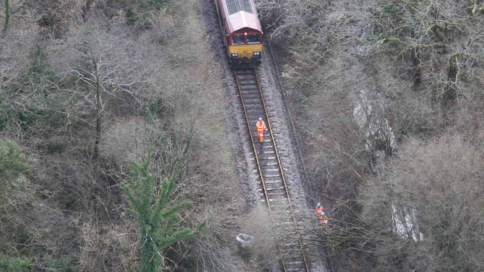 Aerial view of engineers clearing a fallen tree from the tracks near Llangadog, Carmarthenshire