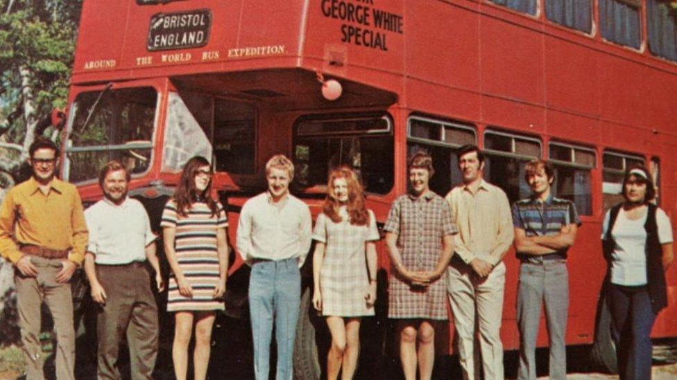 The group next to the double decker bus