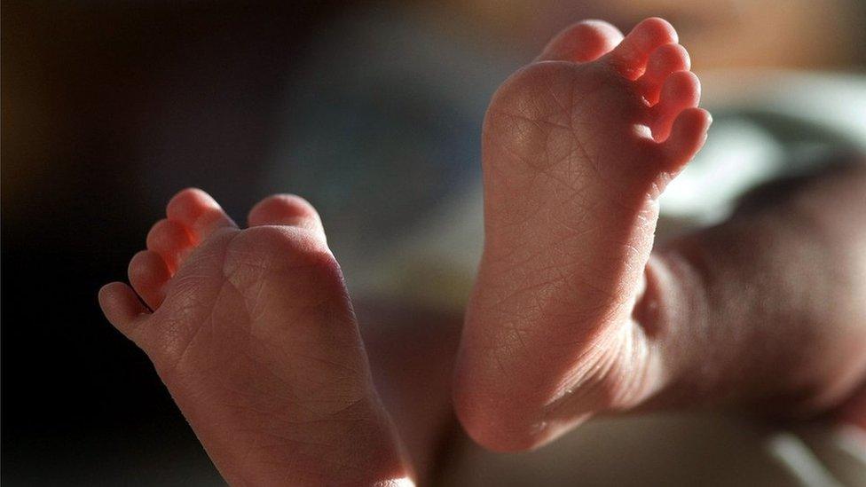 Close-up of a baby's tiny feet