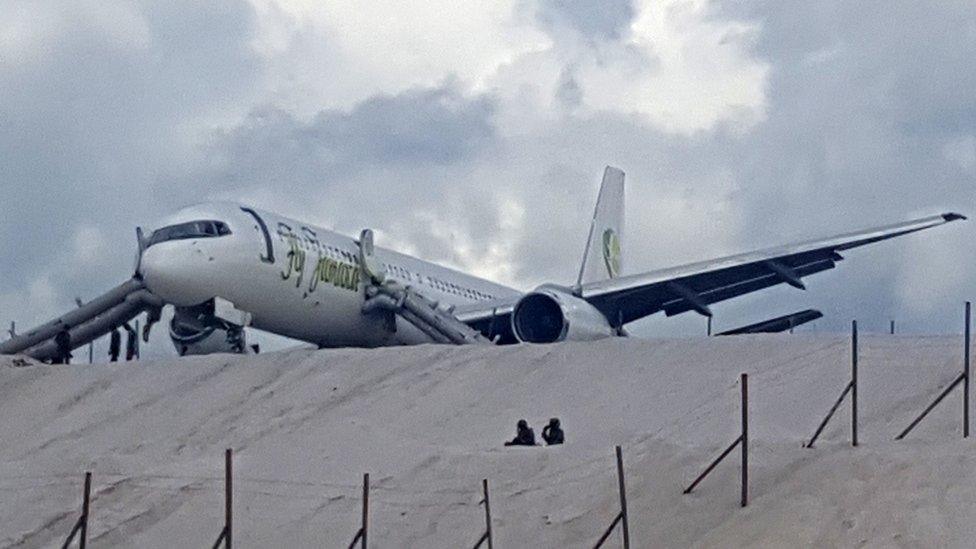 A Toronto-bound Fly Jamaica airplane is seen after crash-landing at the Cheddi Jagan International Airport in Georgetown, Guyana on November 9, 2018