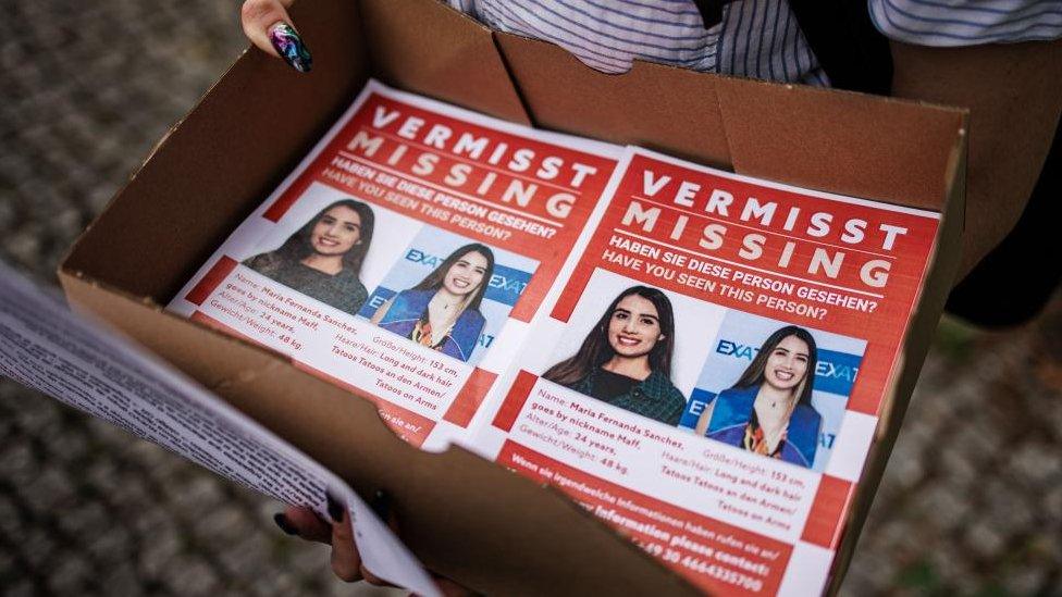 A participant holds a box with informational flyers during preparations for a search operation for a missing Mexican woman after a solidarity event in front of the embassy of Mexico in Berlin, Germany, 05 August 2023. A