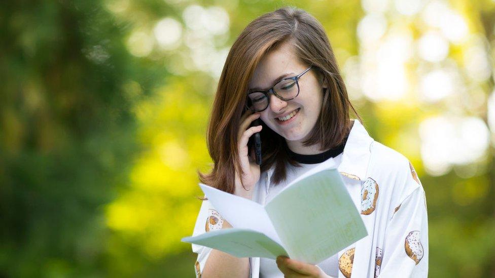 Kathryn Bond speaks on the phone after receiving her A -level results on August 15, 2019 in Swansea