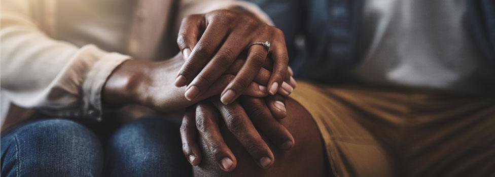 Couple holding hands