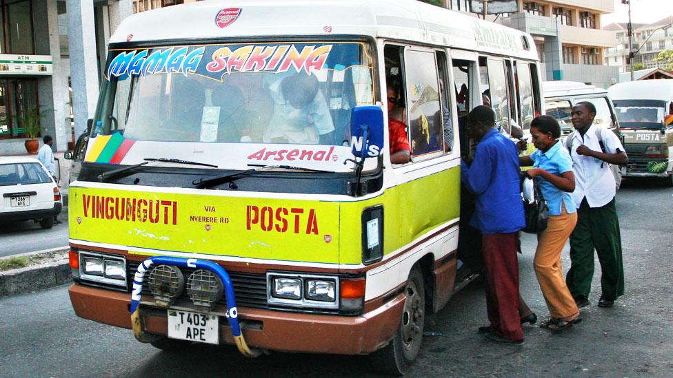 People getting on a bus in Dar es Salaam, Tanzania