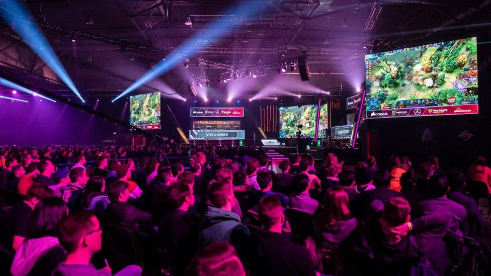 Visitors watch a game of an e-sport tournament `Dota 2` during the digital festival DreamHack Leipzig on January 25, 2020 in Leipzig, Germany.