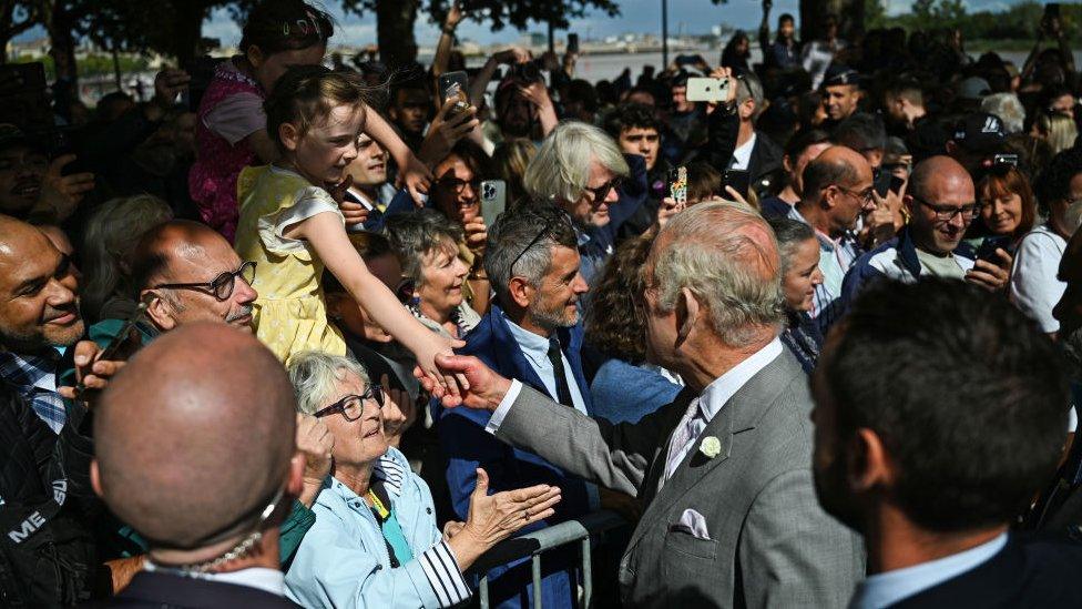 King greets crowds