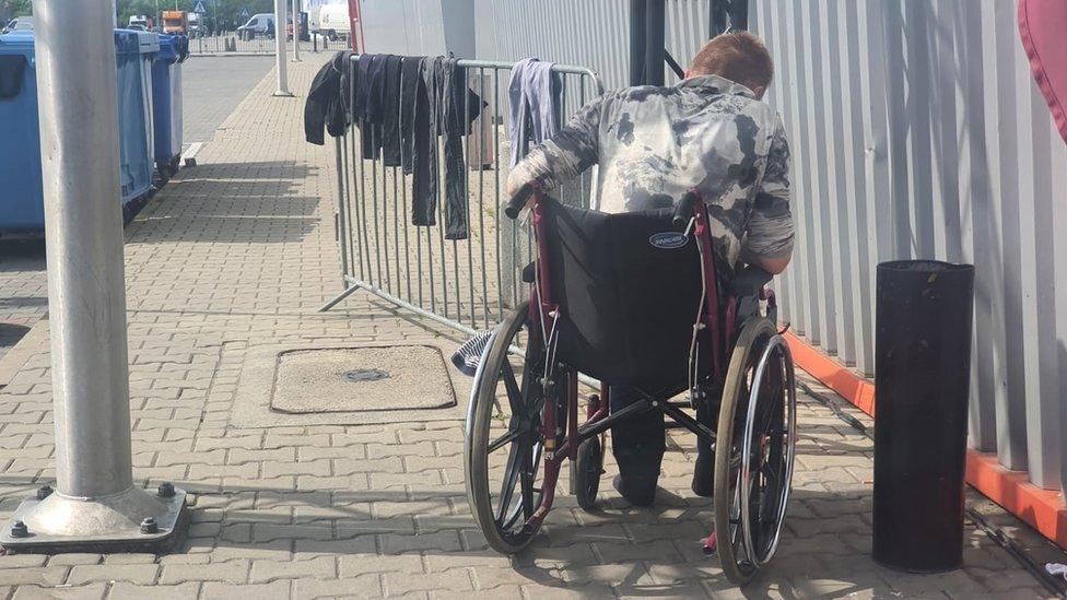 Washing being dried outside building