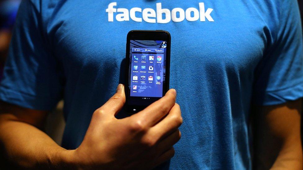 Facebook t-shirt and phone