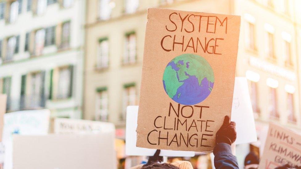 A-banner-saying-system-change-not-climate-change.