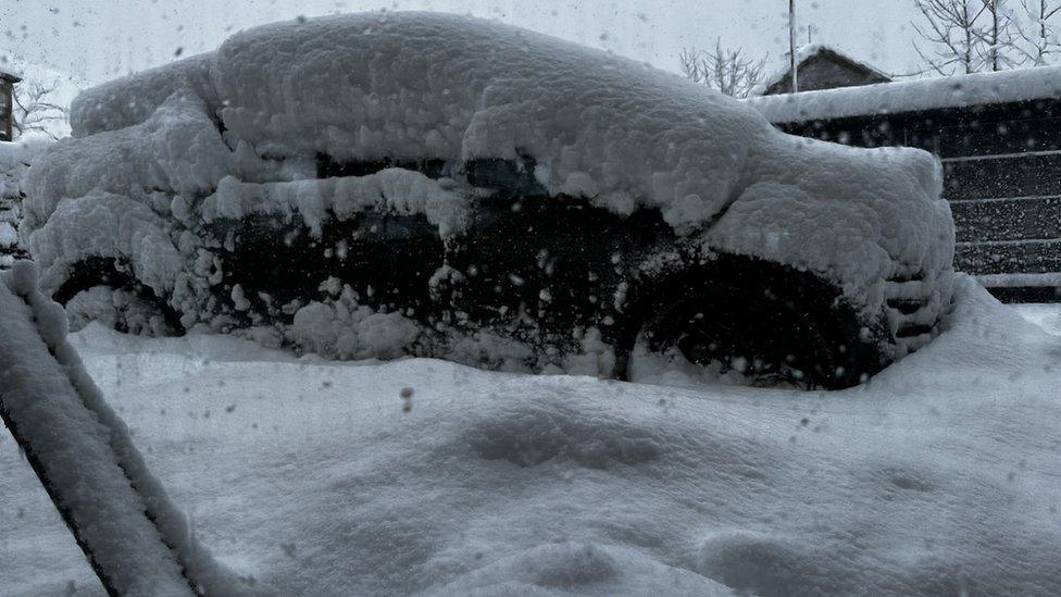 Car covered in snow