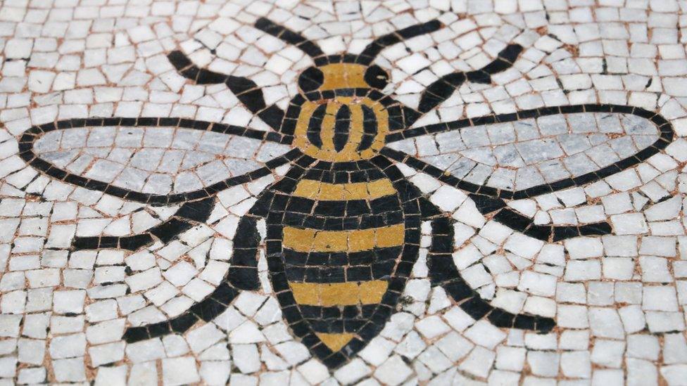 A Manchester Worker Bee incorporated into the floor of the Town Hall in Manchester.