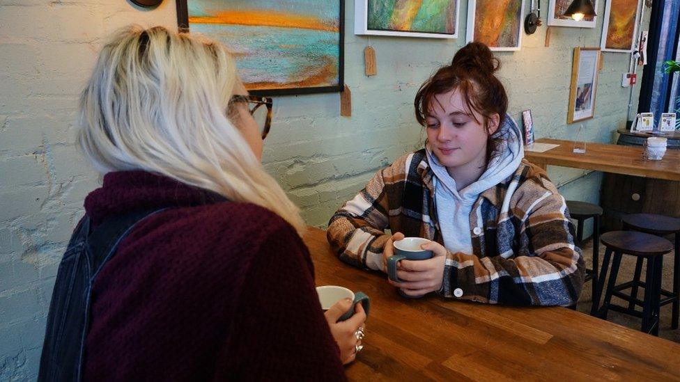 Mentor and mentee meeting in a cafe