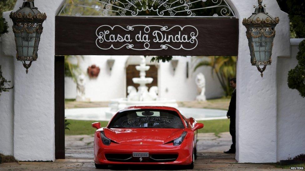 A federal policeman drives a seized luxury car from the residence of Brazilian Senator Fernando Collor de Mello, in Brasilia, Brazil July, 14, 2015.