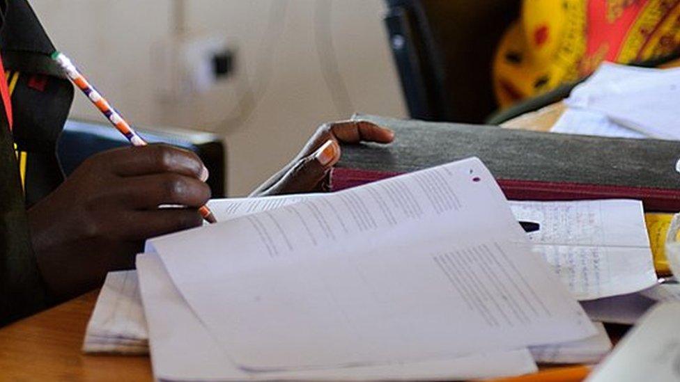 Young Maasai men and women studying for an exam at the Koiyaki Guiding School in the Naibosho Conservancy on the edge of the Maasai Mara game reserve July 7, 2012