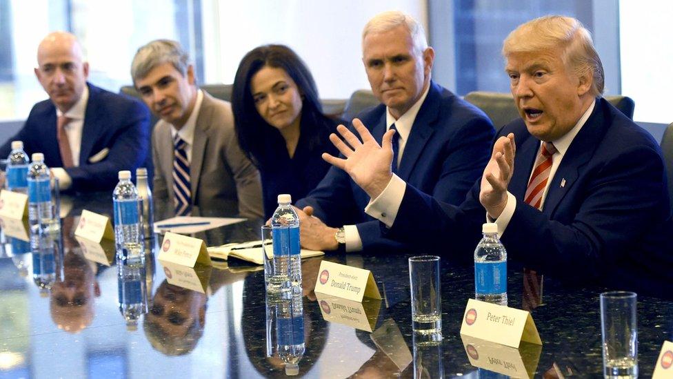 Donald Trump (R) meets technology leaders. File photo