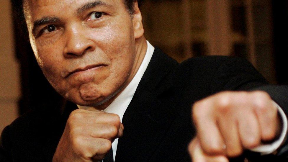 U.S. boxing great Muhammad Ali poses during the Crystal Award ceremony at the World Economic Forum (WEF) in Davos, Switzerland, in this January 28, 2006 file photo.