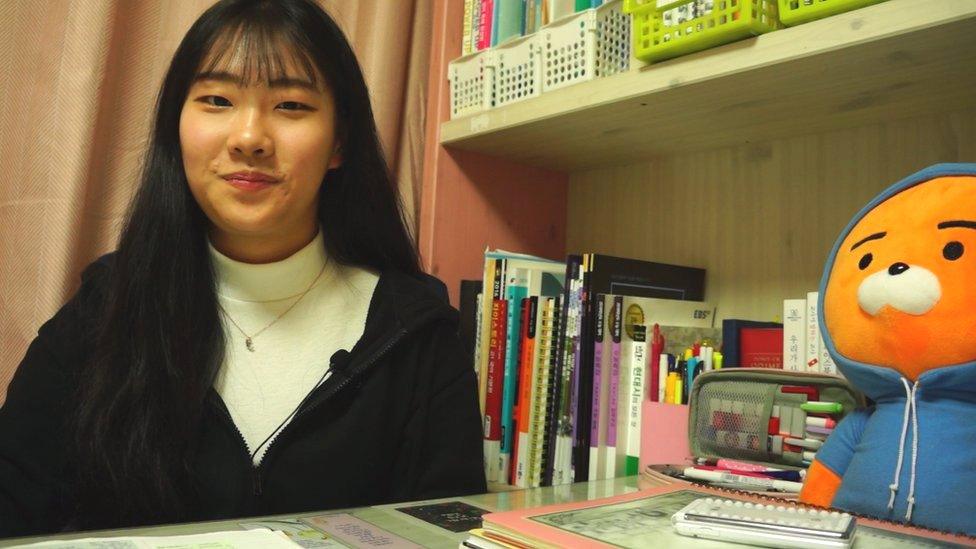 Ko Eun-suh in her bedroom full of textbooks and revision notes