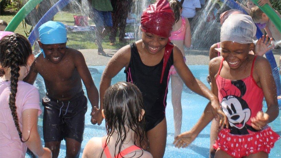 black kids having fun in the water