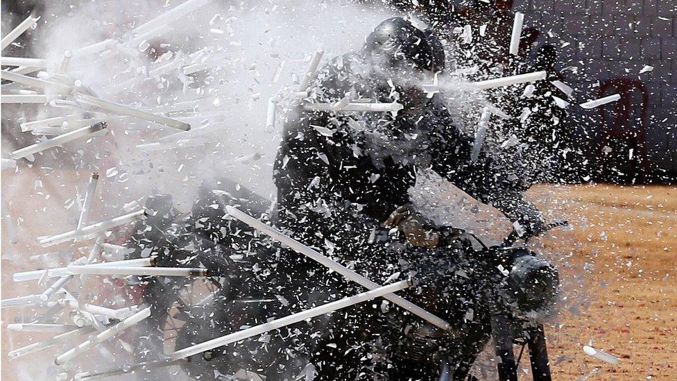 An Indian Army Jawan (soldier) belonging to the "ASC Tornadoes" daredevil bike team performs during the 71st Republic Day celebrations in Bangalore, India, 26 January 2020.