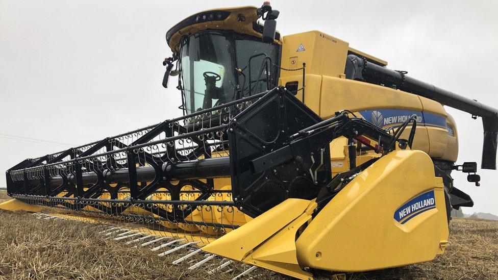 A combine harvester in a field