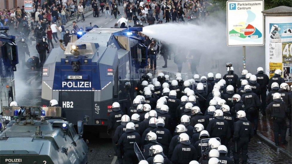 German police use water cannons against protesters in Hamburg