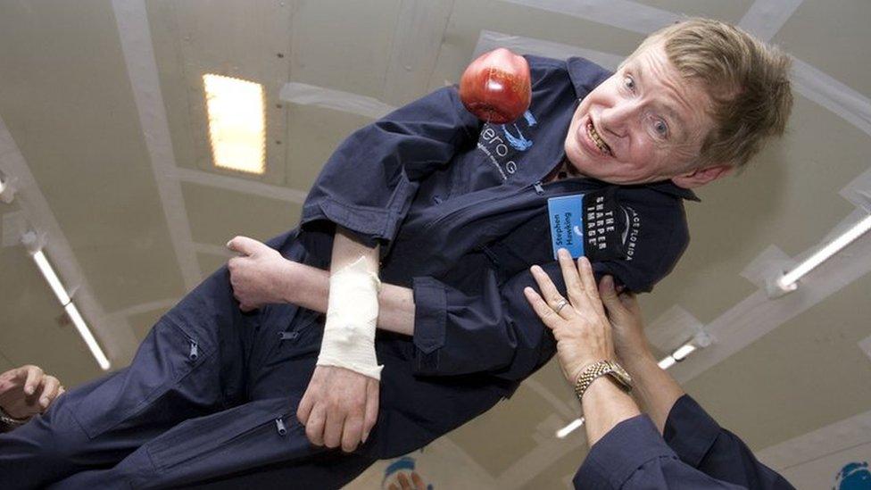 Stephen Hawking floats as he experiences zero gravity