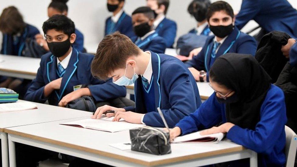 Children in class wearing masks