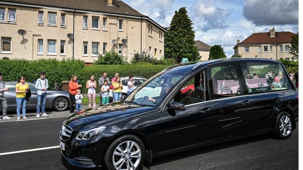 Fiona's pink coffin led the procession as local people paid their respects