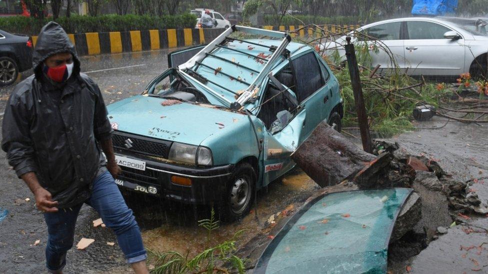 Car smashed by fallen tree in Mumbai, India, 17 May 2021