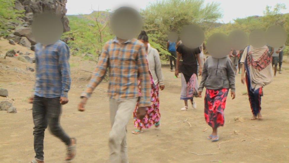 a blurred photo of teenagers in afar