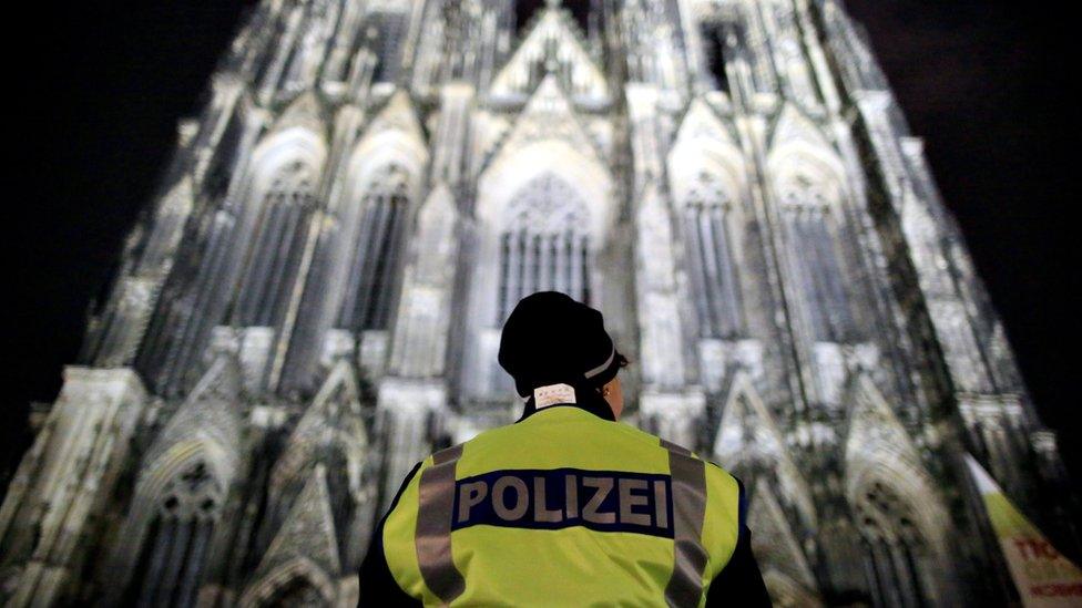 A police officer stands in front of the Cologne Cathedral in Cologne, Germany, 24 December 2016