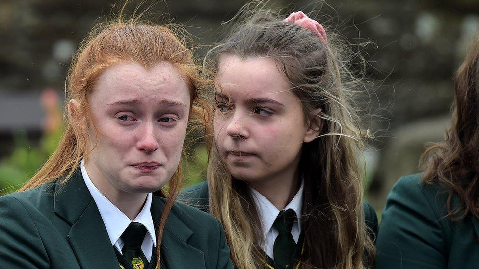 Two schoolgirls attend the funeral of Lauren Bullock