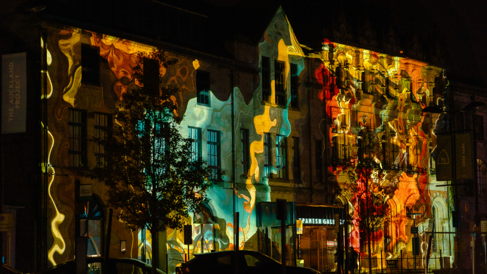 The Spanish Gallery in Bishop Auckland lit up by projections