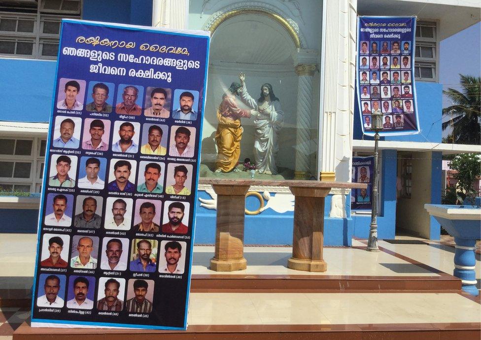 Photographs of the missing fishermen displayed at a local church