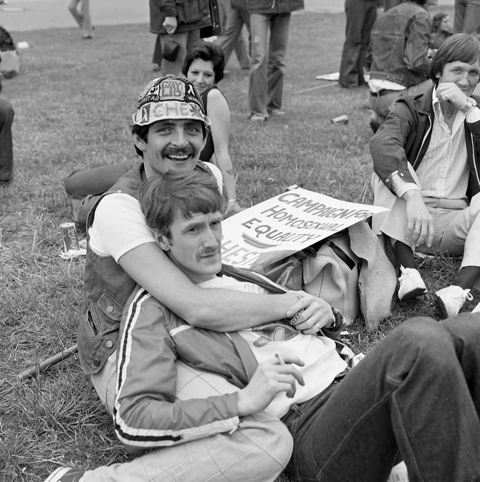 People attend the Pride march in 1977