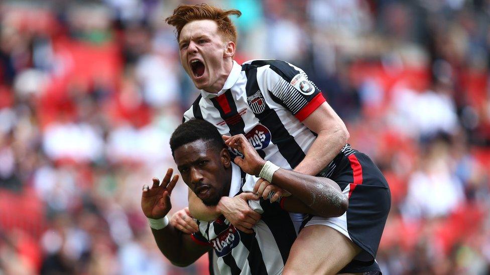 Grimsby"s Omar Bogle celebrates with team mate Jon Nolan after scoring in the play-off final