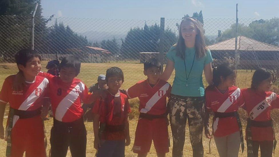 Jo Penrose with a group of children