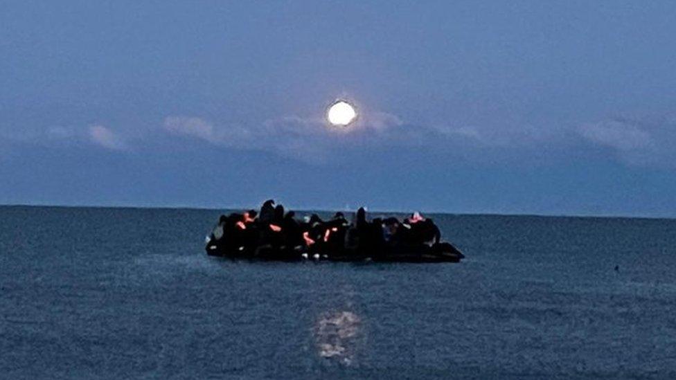 Migrants are packed on a boat in the sea off Wimereux near Boulogne in France