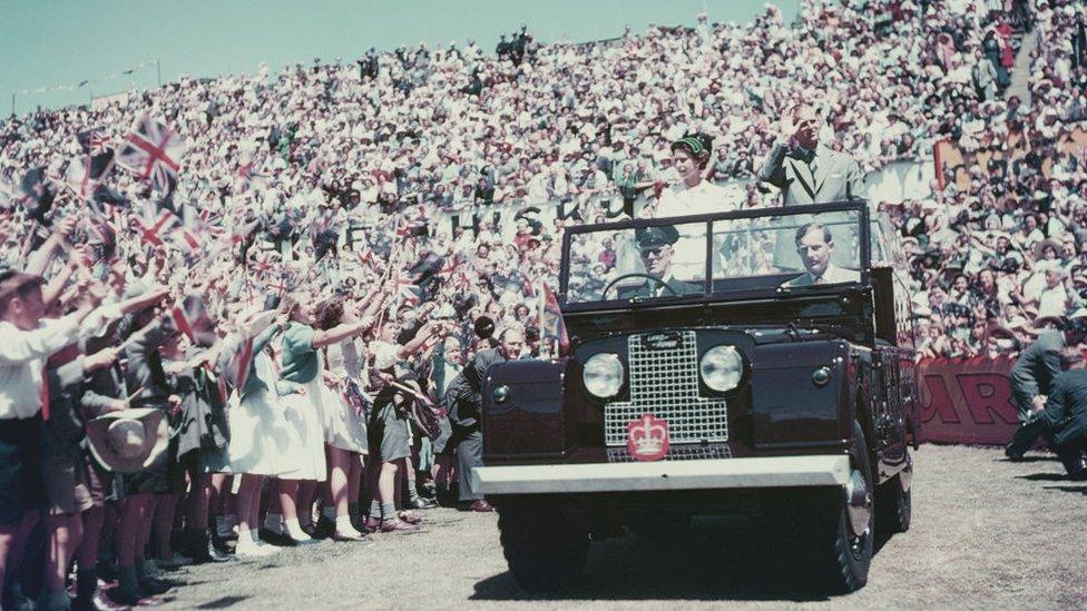 Queen Elizabeth II and Prince Philip wave to the crowd on their visit to Australia in 1954