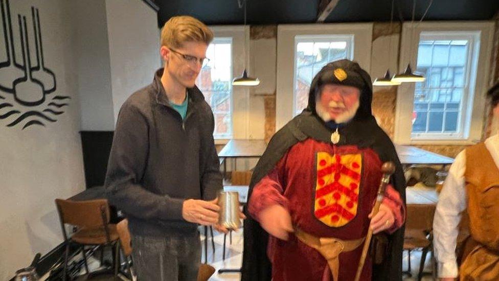 Andrew Fisher from Hop Kettle Brewery standing next to the town crier